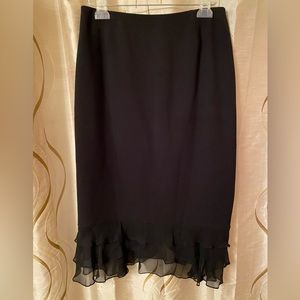 Carmen Marc Valvo black pencil skirt with ruffle silk hem. Size 10.